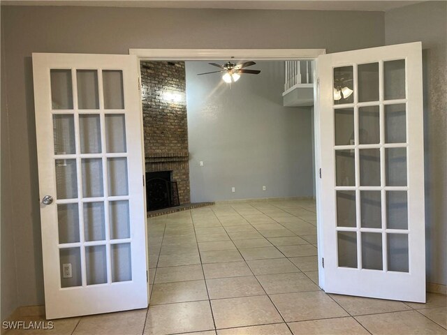 200 Ridgewood Ave, Clewiston, FL 33440 - unfurnished living room with tile patterned floors, ceiling fan, and a brick fireplace