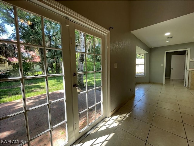 200 Ridgewood Ave, Clewiston, FL 33440 - doorway to outside featuring tile patterned floors, recessed lighting, and baseboards