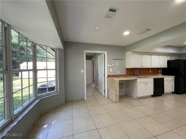 kitchen featuring light tile patterned flooring, sink, white cabinets, decorative backsplash, and black appliances