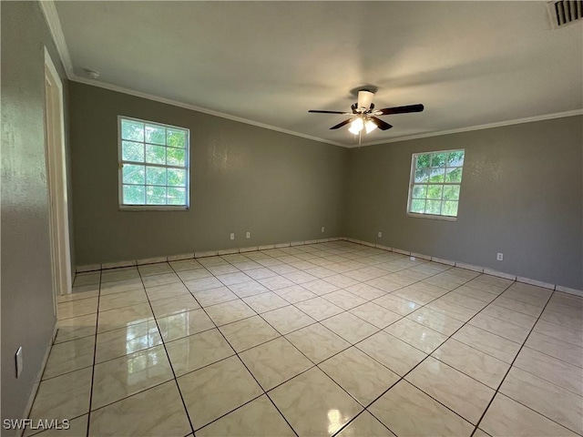 tiled spare room featuring ornamental molding and ceiling fan