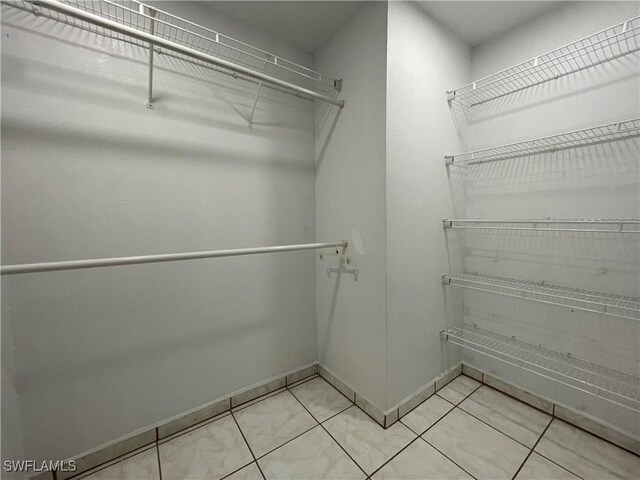 200 Ridgewood Ave, Clewiston, FL 33440 - walk in closet featuring light tile patterned floors