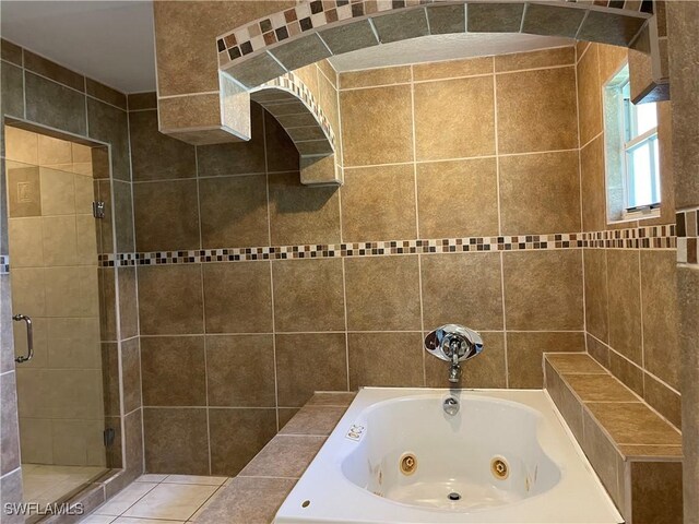 bathroom with shower with separate bathtub