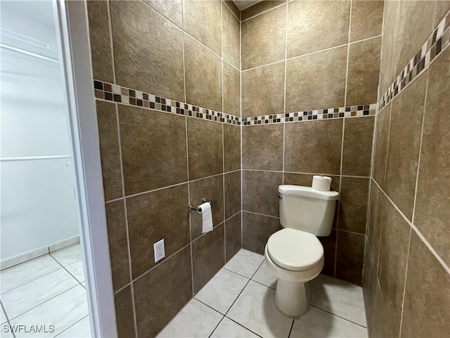 bathroom with tile patterned flooring and toilet