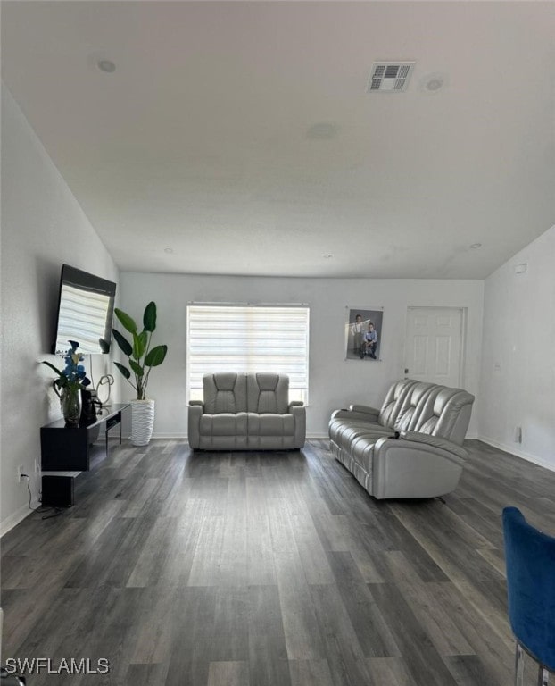 living room with dark wood-type flooring