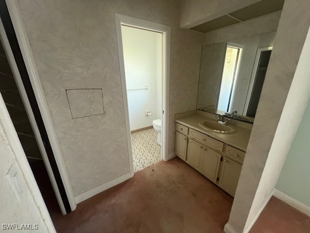 bathroom with vanity and toilet