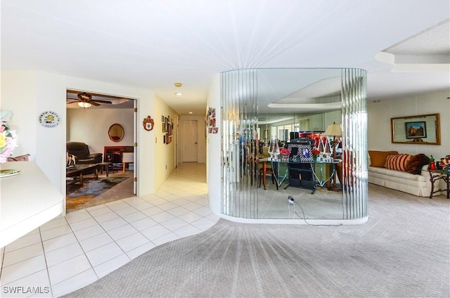 interior space featuring ceiling fan and light tile patterned flooring