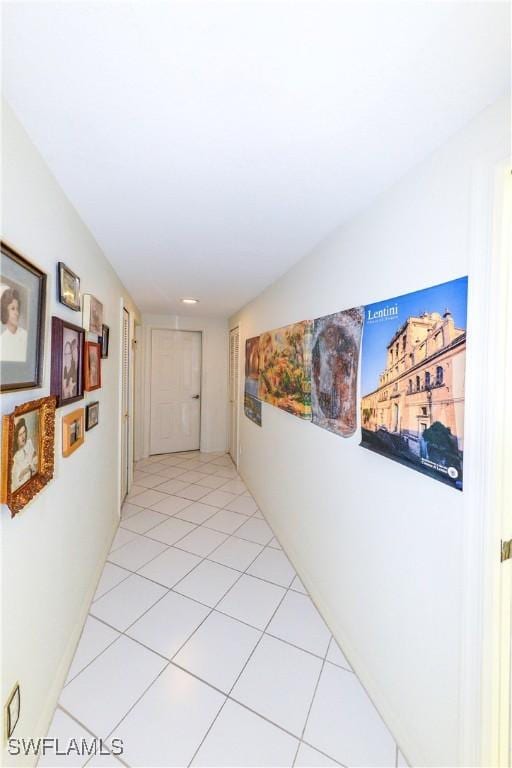 corridor with light tile patterned flooring