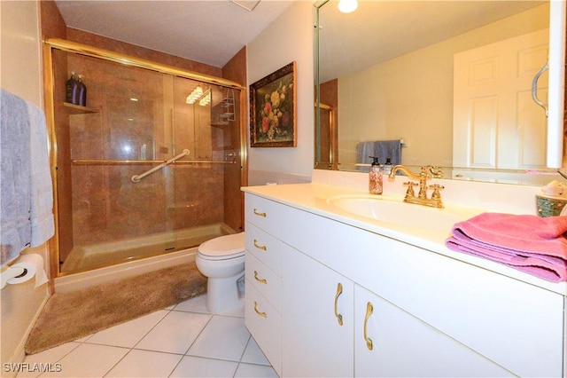 bathroom with walk in shower, tile patterned floors, toilet, and vanity