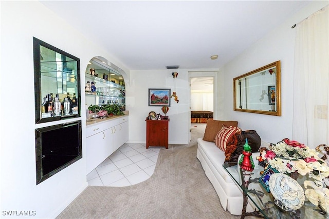 bar with light carpet and white cabinets