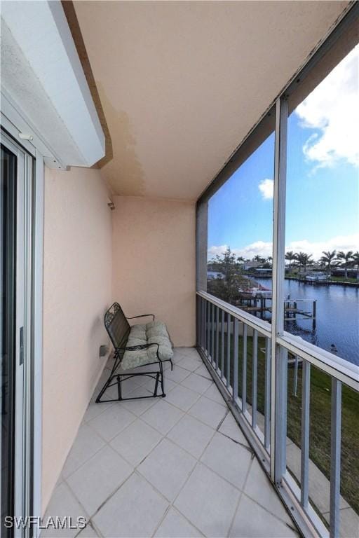 balcony featuring a water view