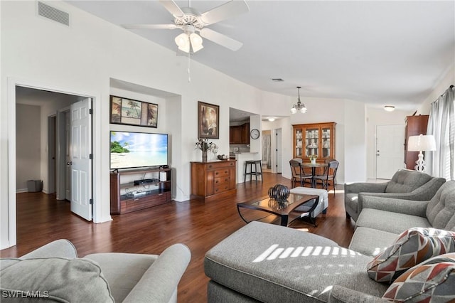 living room with lofted ceiling, dark wood-type flooring, and ceiling fan