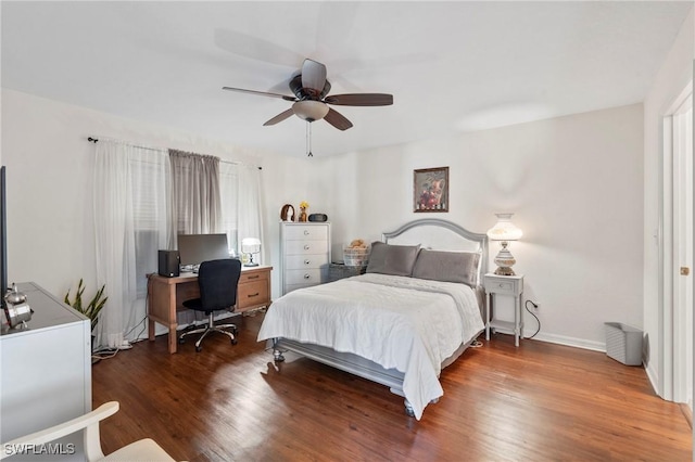 bedroom featuring ceiling fan and dark hardwood / wood-style flooring