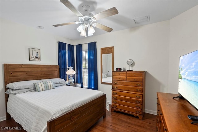 bedroom featuring ceiling fan and dark hardwood / wood-style flooring