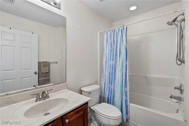 full bathroom featuring vanity, toilet, and shower / tub combo with curtain