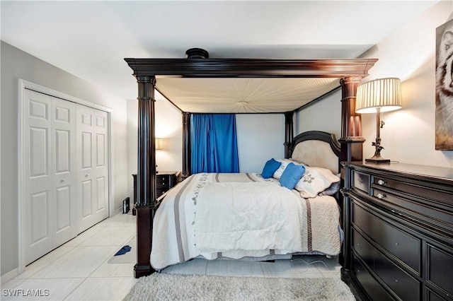 bedroom featuring light tile patterned flooring and a closet