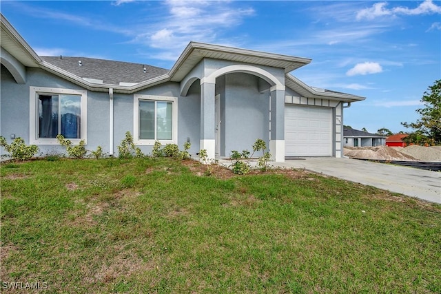 exterior space with a garage and a front yard