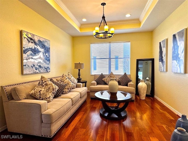 living room featuring crown molding, a tray ceiling, and dark hardwood / wood-style flooring