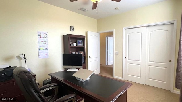 home office with ceiling fan and light colored carpet