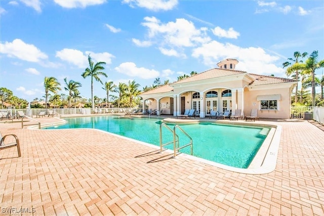 view of swimming pool featuring a patio area