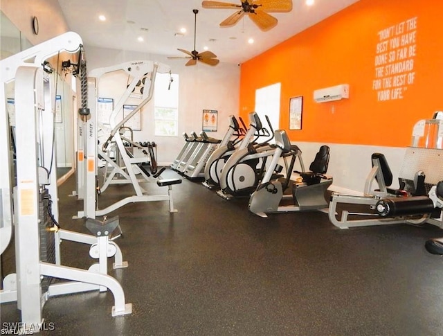 gym featuring ceiling fan and a wall mounted AC