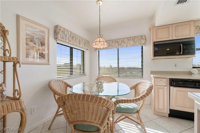 dining area featuring light tile patterned floors