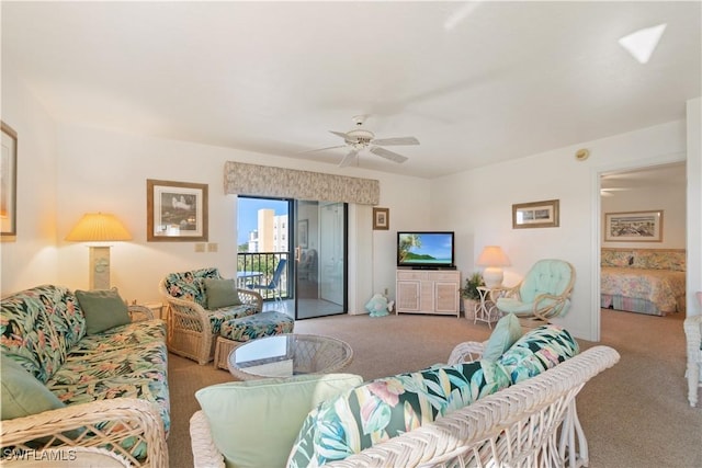 living room featuring ceiling fan and carpet flooring