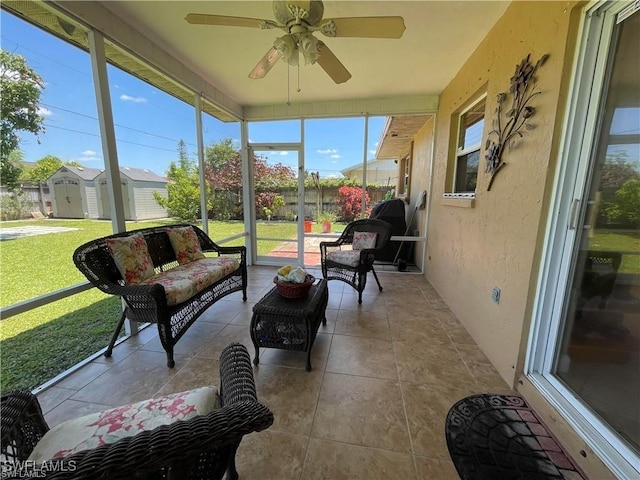 sunroom featuring ceiling fan