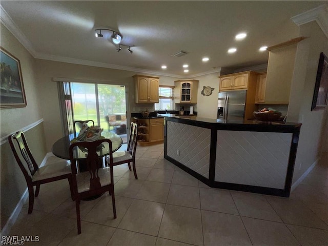 kitchen featuring stainless steel fridge, ornamental molding, light tile patterned flooring, light brown cabinetry, and kitchen peninsula