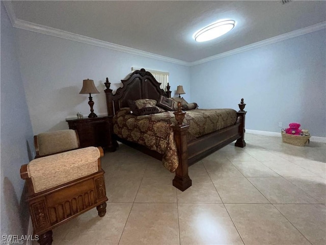 bedroom with ornamental molding and light tile patterned floors