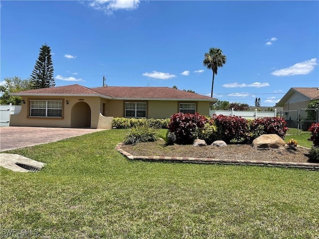 single story home with a front yard