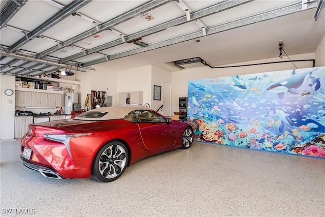 garage with a garage door opener and water heater