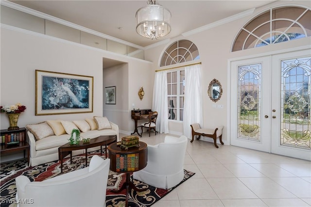 tiled living room featuring french doors, ornamental molding, and a chandelier