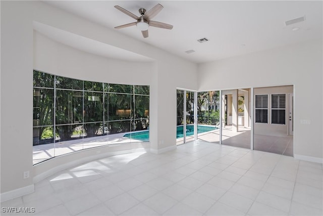 view of swimming pool featuring ceiling fan