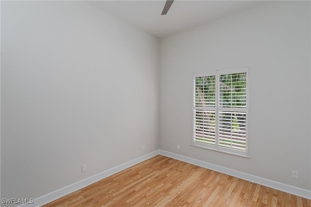 spare room featuring ceiling fan and light hardwood / wood-style floors