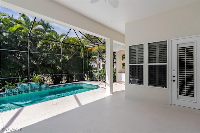 view of pool with a patio and a lanai