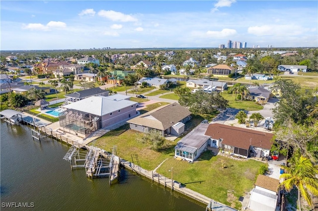 birds eye view of property featuring a water view