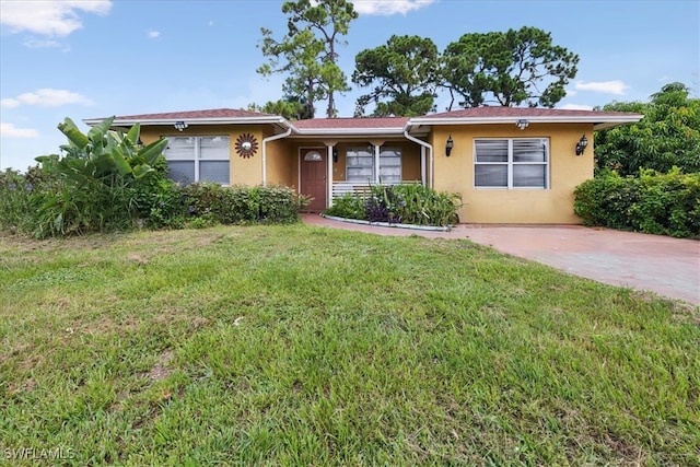 ranch-style house with a front lawn