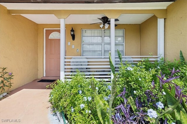 doorway to property featuring ceiling fan