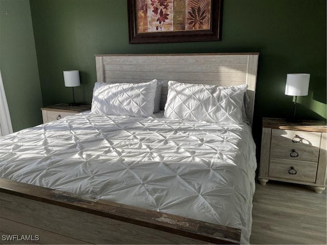 bedroom featuring hardwood / wood-style floors