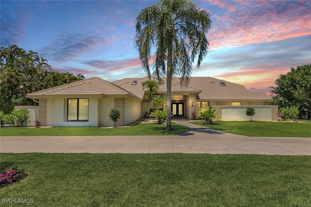 view of front of house with a yard