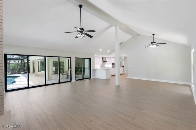 unfurnished living room with beamed ceiling, ceiling fan, high vaulted ceiling, and light hardwood / wood-style floors