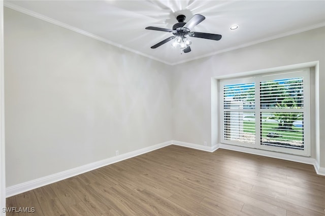 empty room with hardwood / wood-style floors, crown molding, and ceiling fan