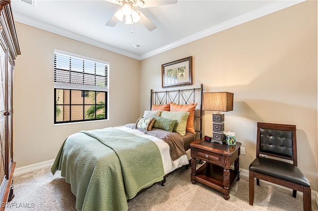 carpeted bedroom featuring ornamental molding and ceiling fan