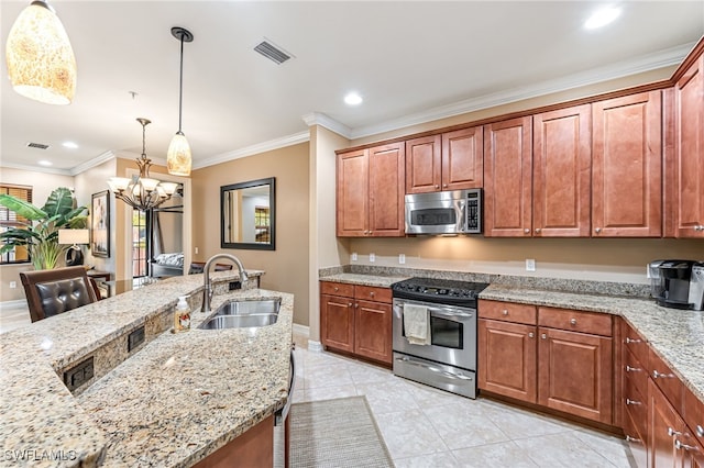 kitchen with pendant lighting, sink, crown molding, stainless steel appliances, and light stone countertops