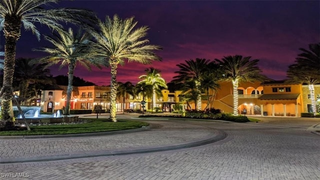 view of outdoor building at dusk