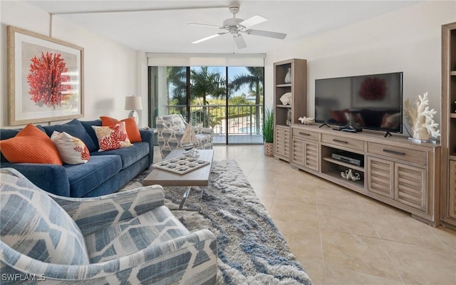 living room with ceiling fan and light tile patterned floors