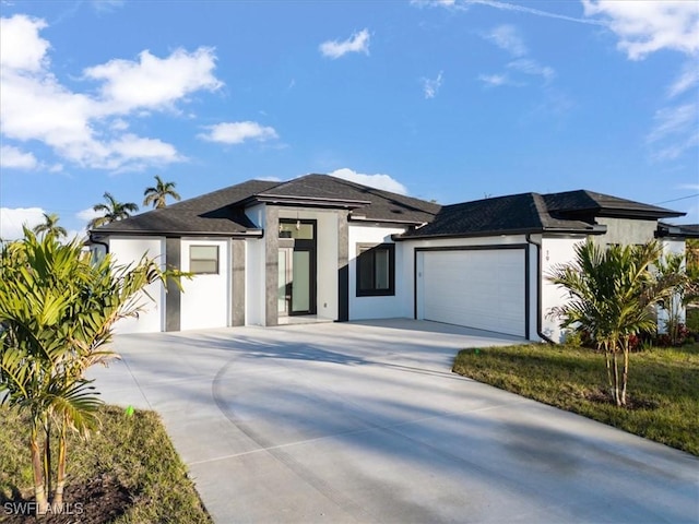 prairie-style home featuring a garage