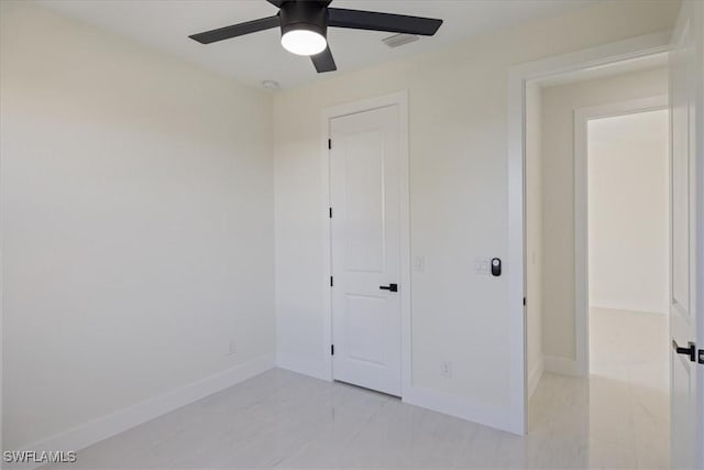 unfurnished bedroom featuring ceiling fan