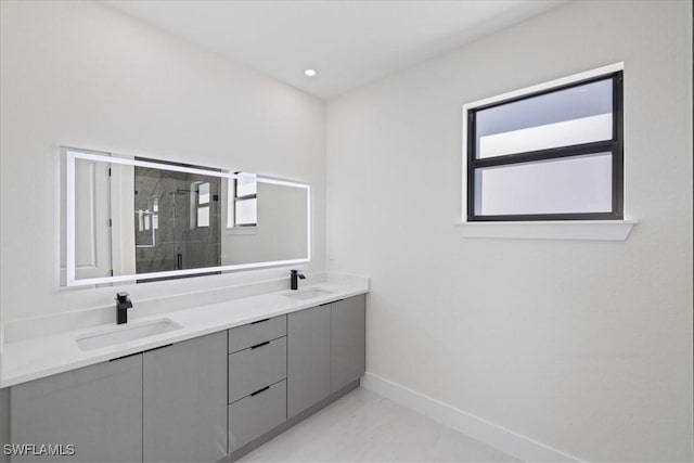 bathroom featuring vanity and a shower with shower door