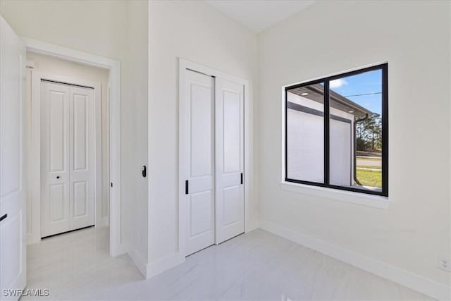 unfurnished bedroom with a closet